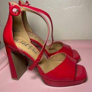 Brand new (never worn) 5.5 red wild pair heels. In great condition.